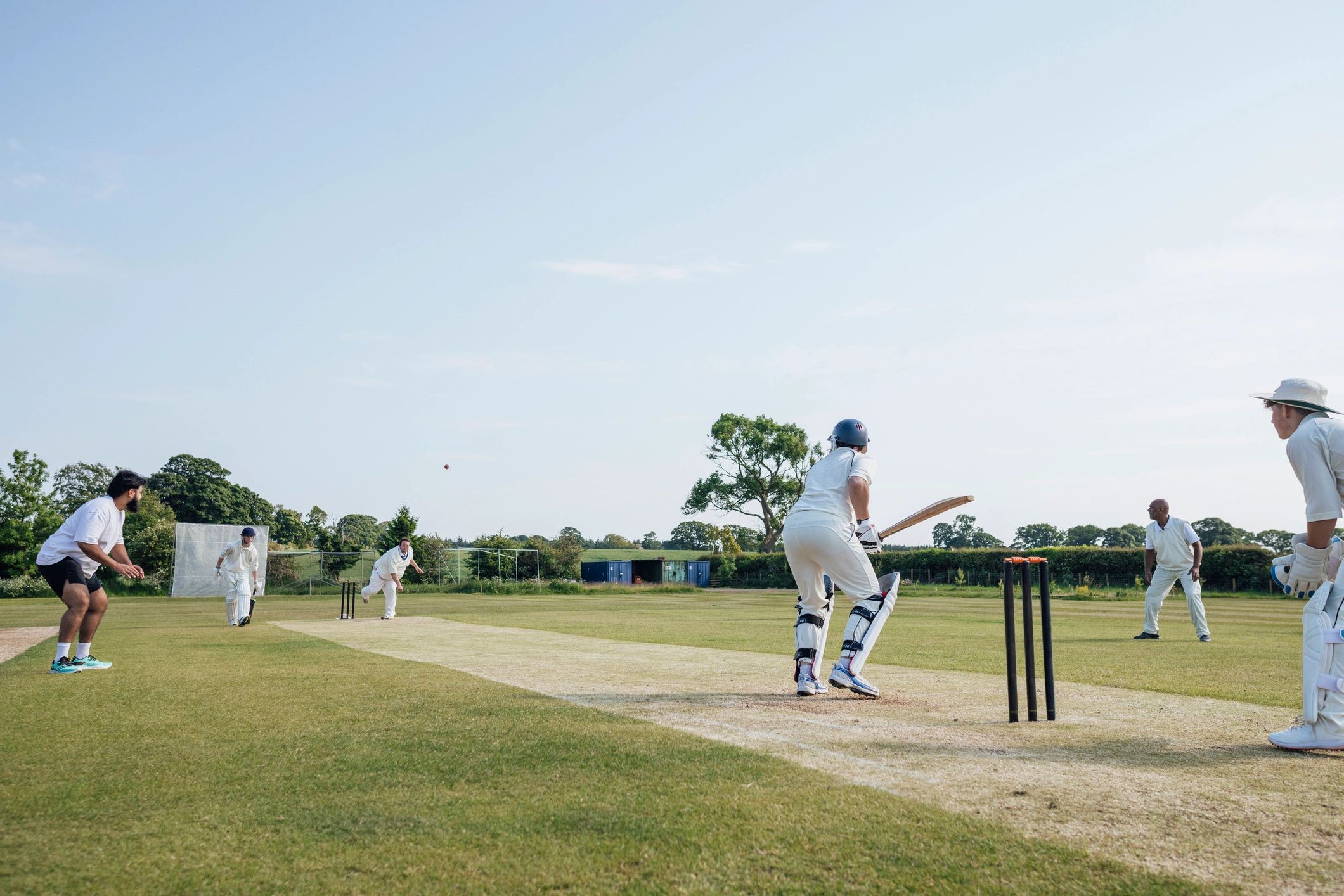 Cricket team practicing on a field