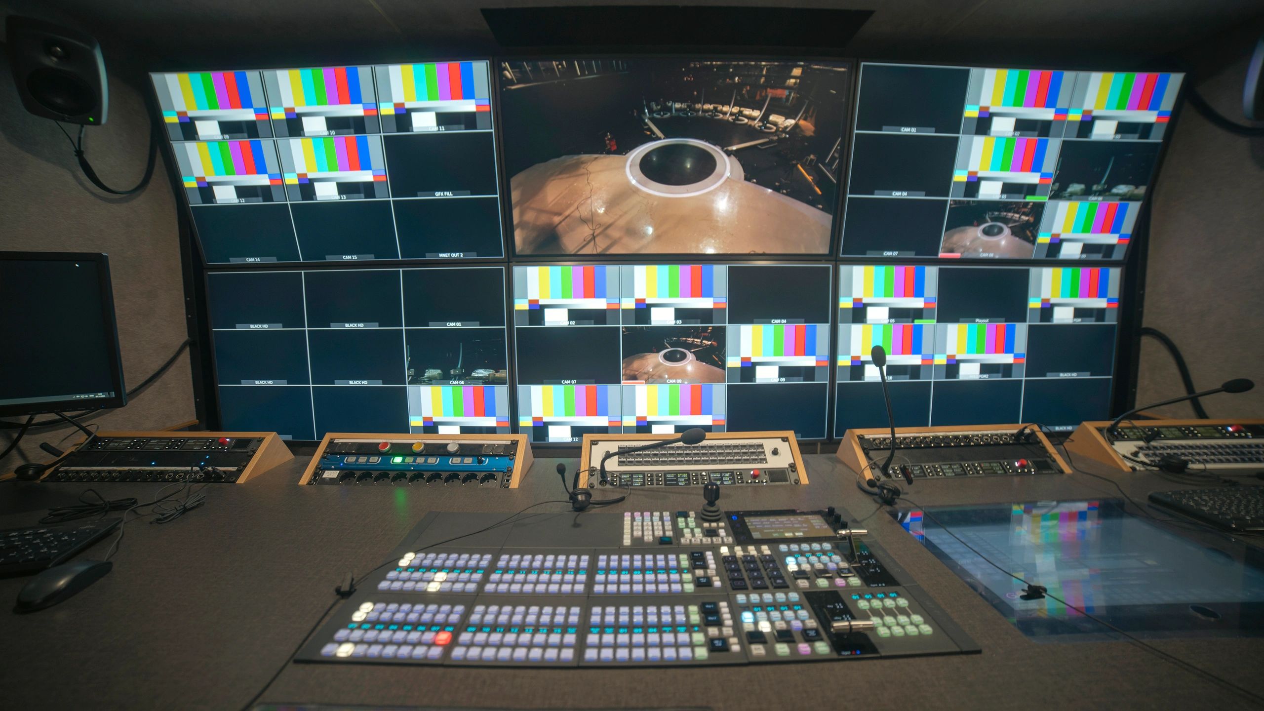Broadcast control room with video monitors
